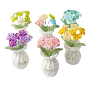 Set of six handmade crochet forget-me-not potted plants with decorative tags