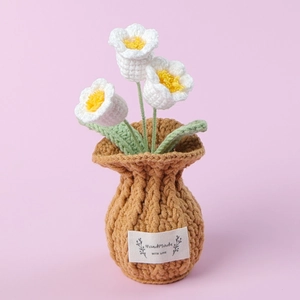 Detail of handmade crochet white flowers in a potted vase with Handmade with Love label
