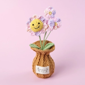 Handmade crochet sunflower potted plant with pink purple gradient petals and smiley face