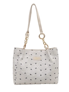Chic off-white pleated tote bag with black bow print and gold chain strap on white background