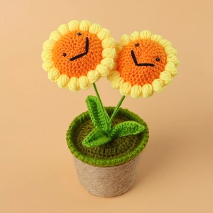 Handmade crochet sunflower potted plant with cute smiley faces and natural jute base