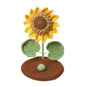 Hand-crocheted sunflower phone holder with knitted base for tabletop decoration