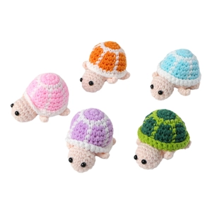 Set of five handmade crochet turtle plush pendants in various soft pastel colors
