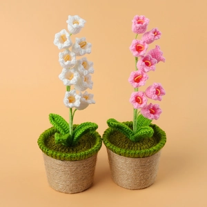 Close-up of handmade crochet lily of the valley potted plants with twine-wrapped pots
