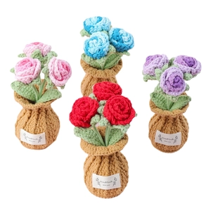 Handmade crochet rose flower pots in pink, blue, purple and red for home decor