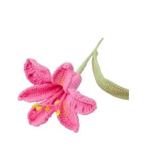 Handmade crochet pink lily flower with green stem and yellow pistil on white background