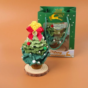 Handmade crochet Christmas tree decor with wooden base and festive gift bag