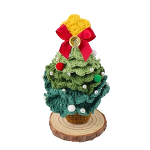 Handmade crochet Christmas tree with pearl ornaments and star on a wooden base