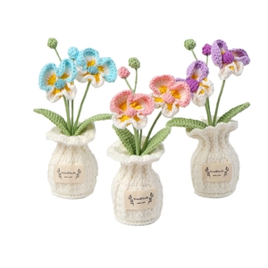 Handmade crochet butterfly orchid potted flowers in blue, pink, and purple colors