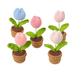 Five handmade crochet tulip potted plants in various pastel colors on a white background