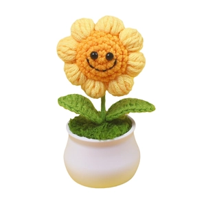 Handmade crochet sunflower potted plant with a cute smiley face for home office desk decor
