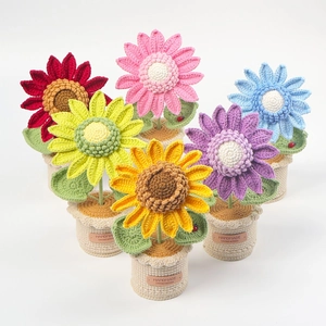 Detail of six handmade crochet sunflower potted plants in various bright colors