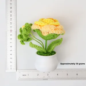 Handmade knitted sunflower plant detail showing size 12cm height and 58g weight measurement
