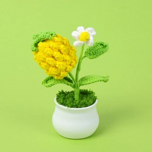 Handmade crochet pineapple with daisy in white ceramic pot for home office desk decor