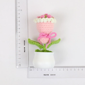 Detail showing height and width dimensions of a handmade crochet pink flower pot
