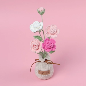 Handmade crochet rose potted plant in beige vase for cute home desktop decoration