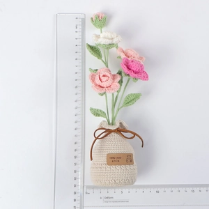 Detail of handmade crochet potted pink roses with keep your smile tag, 25cm height