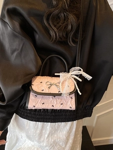 Pink bow-knot pattern crossbody bag with lace pearl charm and black leather handle