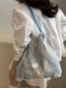 Blue and pink gradient tote bag with floral embroidery and braided shoulder straps