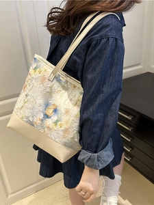 Lace floral tote bag with blue and yellow embroidery and beige faux leather details