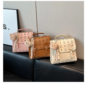 Three mini bear print handbags in pink, brown and beige with scarf and plush charm