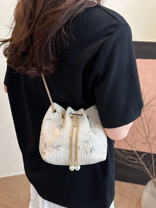Straw bucket bag with floral embroidery and pearl drawstring chain strap for women