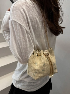 Lace floral embroidered straw bucket bag with drawstring and gold chain strap
