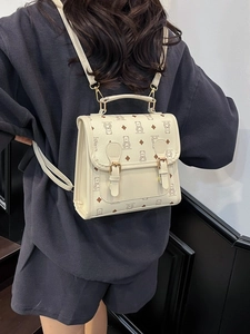Cute beige cartoon bear printed mini backpack with adjustable straps and top handle