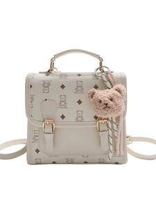 Beige mini backpack with cute cartoon bear print and plush charm for women