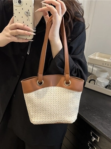 French vintage straw basket bag with beige woven texture and brown leather straps