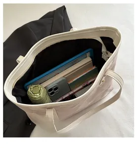 Top view of large capacity floral tote bag showing spacious interior and daily essentials