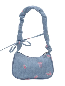 Light blue denim floral shoulder bag with pink bows and a pleated scrunchie strap