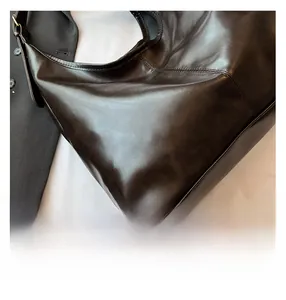 Detailaufnahme der robusten Nähte und hochwertigen Lederstruktur der schwarzen Shopper