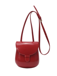 Glossy red saddle crossbody bag for women with adjustable strap and gold hardware detail