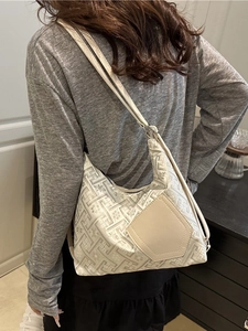 Chic beige jacquard underarm bag with geometric patterns and minimalist shoulder strap