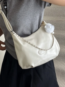 Off-white PU leather hobo crossbody bag with silver chain and plush ball pendant