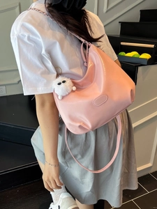 Pink glossy faux leather tote shoulder bag with metallic chain and plush monster charm