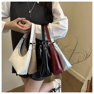 Detailed comparison of five glossy patent leather shoulder bags in various colors for women