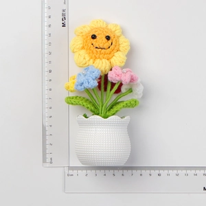 Handmade crochet sunflower potted plant home decor with measurement ruler showing 15cm height