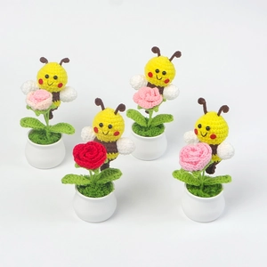 Set of 4 handmade crochet potted bumblebees with pink and red roses on white background