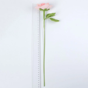 Close-up of handmade crochet pink rose with green leaves showing 44cm stem length