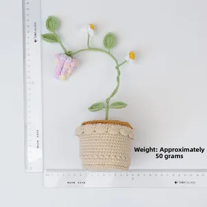 Detail view of handmade crochet grape plant with ruler showing height of 25cm and 50g weight