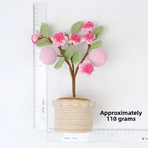 Handmade crochet peach tree plant in beige pot showing dimensions and scale measurement