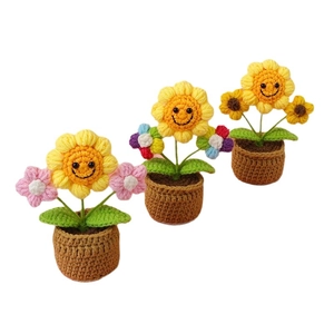 Handmade crochet sunflower potted plant with cute smiling face for desktop decoration