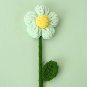 Close-up of handmade crochet puff flower bouquet with soft chenille yarn texture