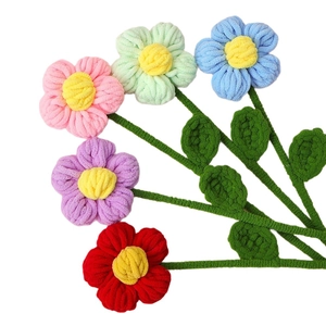 Colorful handmade chenille puff flower bouquet with vibrant hand-knit crochet textures