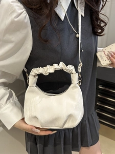 Silver cloud handbag with pleated handle and golden hardware for women's crossbody wear