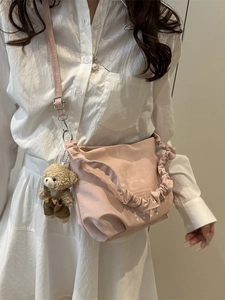 Pink ruffled tote bag with bear charm and adjustable shoulder strap for women