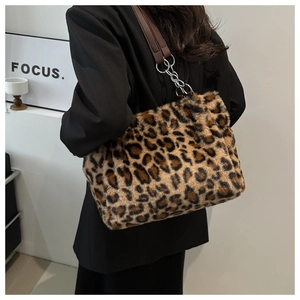 Detail of leopard print faux fur tote with leather and silver chain shoulder strap