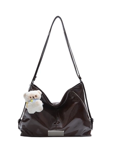 Retro dark brown patent leather tote bag with long straps and white plush bear charm
